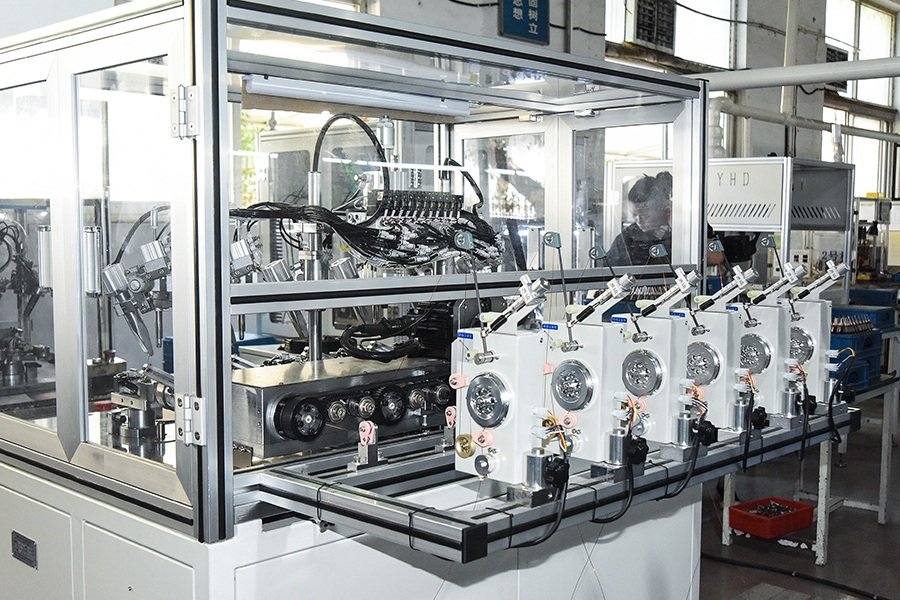 Equipment stations holding motor components